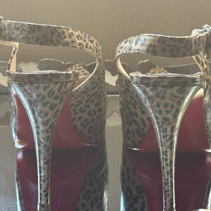 CHRISTIAN LOUBOUTIN
Leopard Print Patent Leather Rolande Slingbacks Size 37 EU.